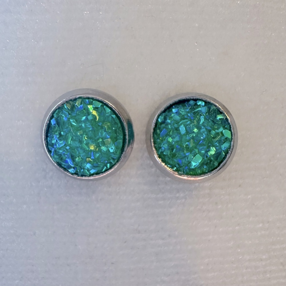 Unisex sparkly green circle post earrings. These earrings shimmer in light.